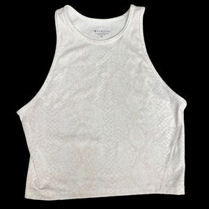 Athleta xs cropped workout top. White with beige detail. Never worn. Racerback.